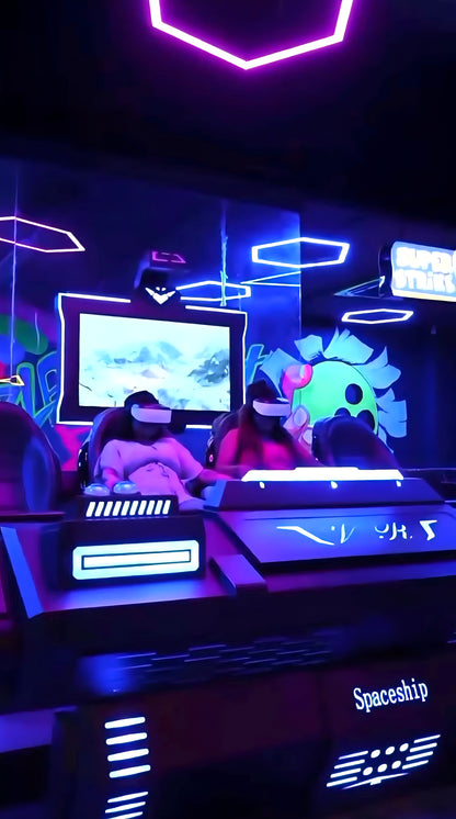 Two young people in VR headsets play a game in a neon-lit arcade.