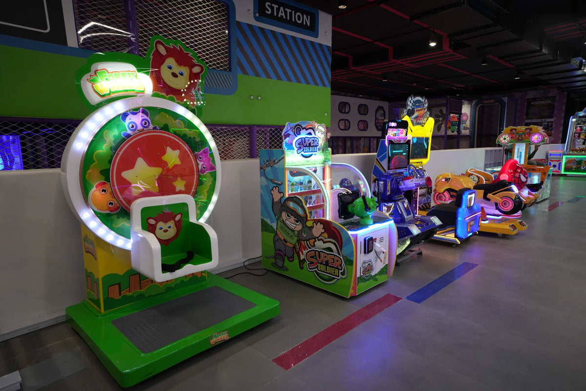Children's arcade with colorful rides and games.