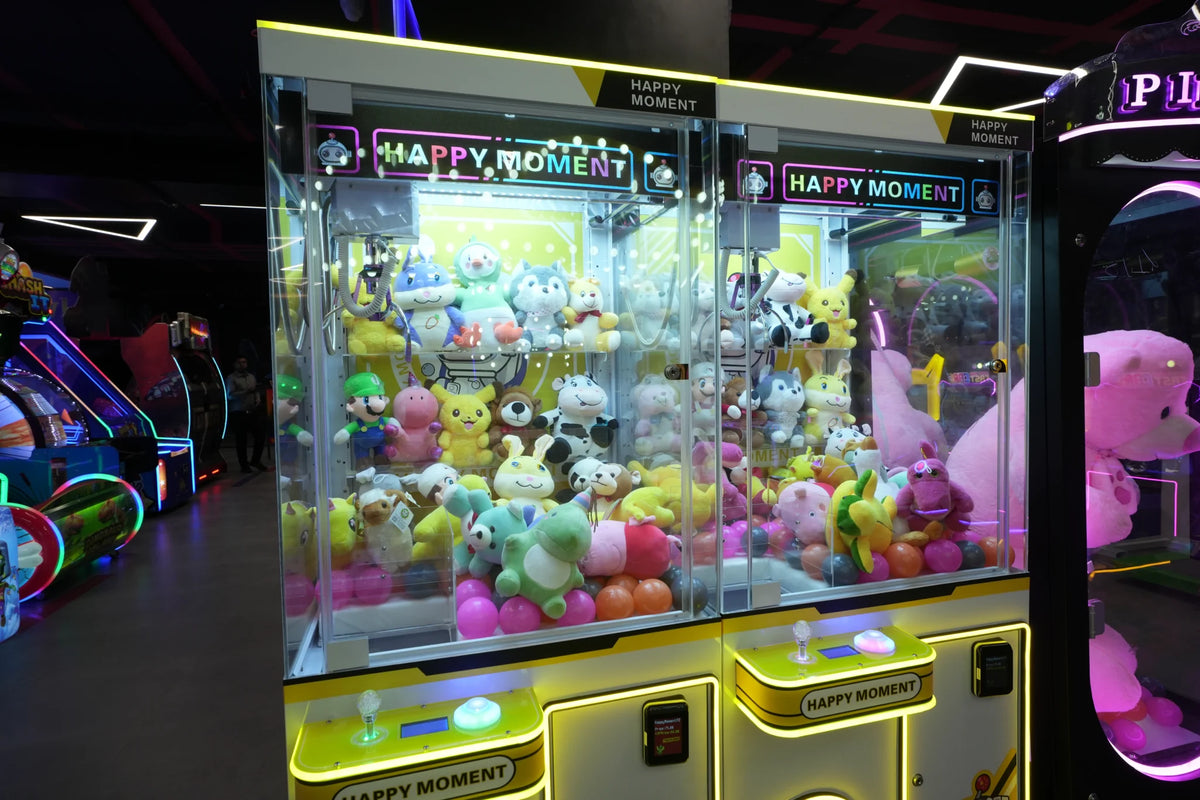 A claw machine filled with plush toys in an arcade.