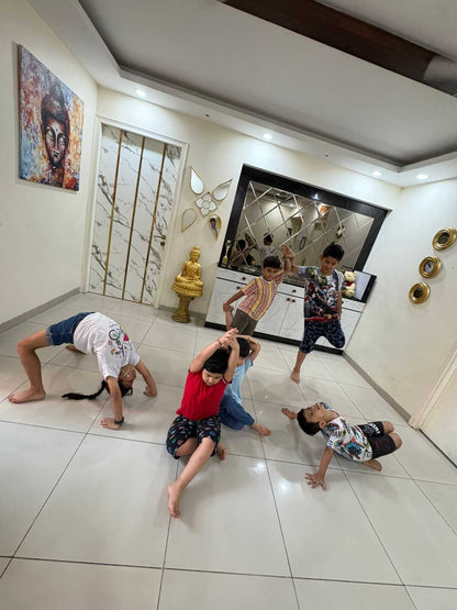 Children playing on a tiled floor in a modern home interior.