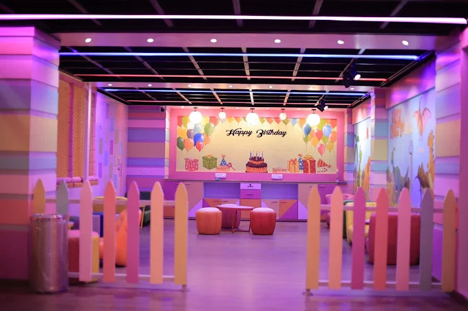 Brightly decorated indoor party room with colorful balloons and pastel furniture at SkyJumper Kids Trampoline Park Gurgaon
