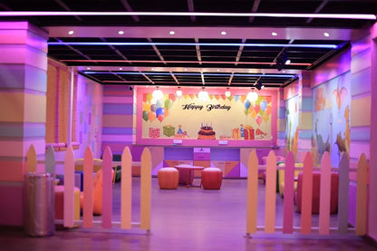 Brightly decorated indoor party room with colorful balloons and pastel furniture at SkyJumper Kids Trampoline Park Gurgaon