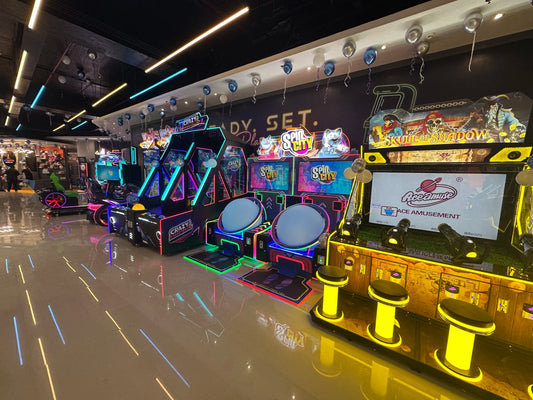 An arcade with colorful lights and game machines, including racing simulators and basketball games.