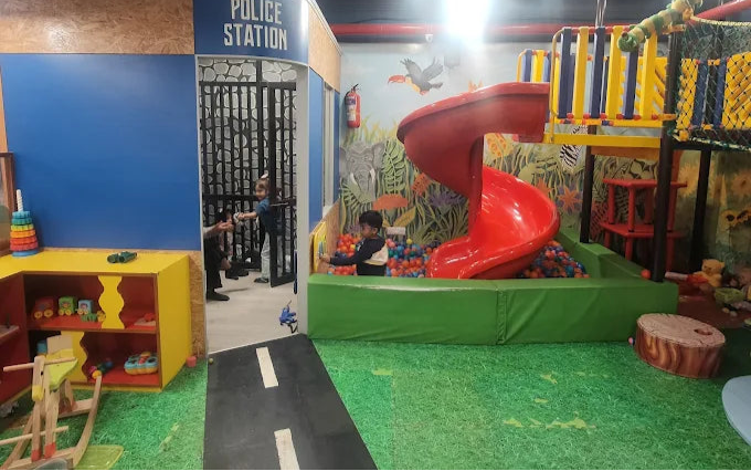 Children's play area with pretend police station and slide