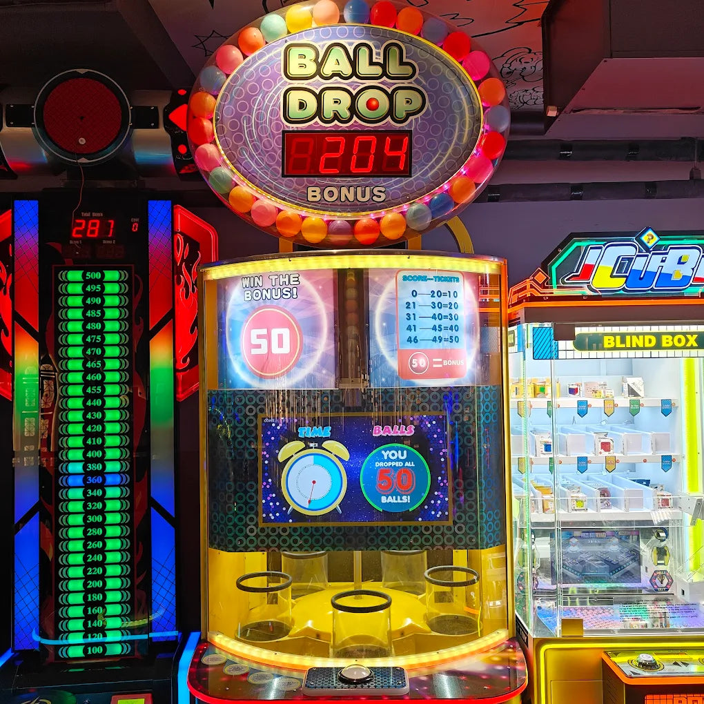 Arcade game "Ball Drop" with colorful balls and a digital score display.