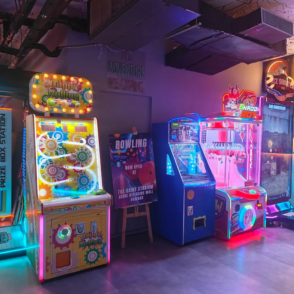 Arcade with colorful, glowing games and a bowling advertisement.