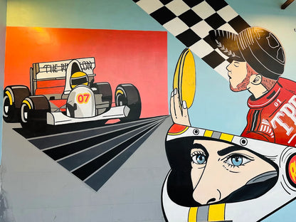 A mural depicts a race car and a driver looking in a mirror.