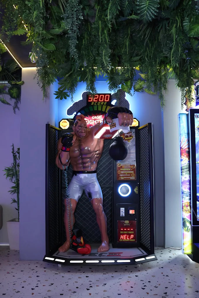 Animated boxing figure with digital display and boxing gloves in a decorative setting.