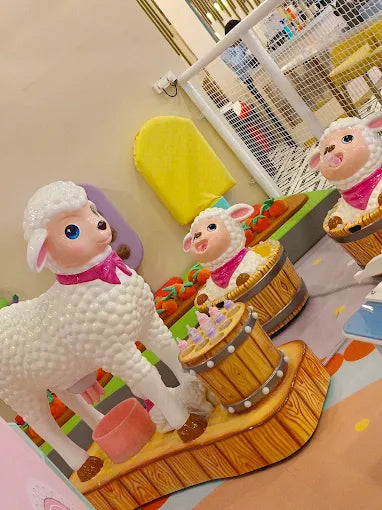 Whimsical farm-themed play area with sheep figures, colorful details, and soft padded flooring at Tooney Tales Gurugram