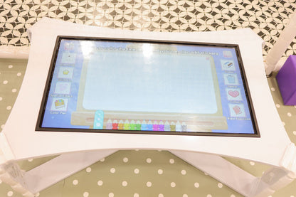 A digital drawing tablet for children, displaying a coloring interface with various tools and options.