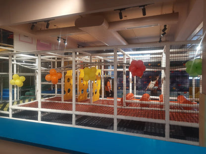 Indoor play structure with colorful flower-shaped balloons creating a cheerful atmosphere at Walk to Wonderland Chhatarpur