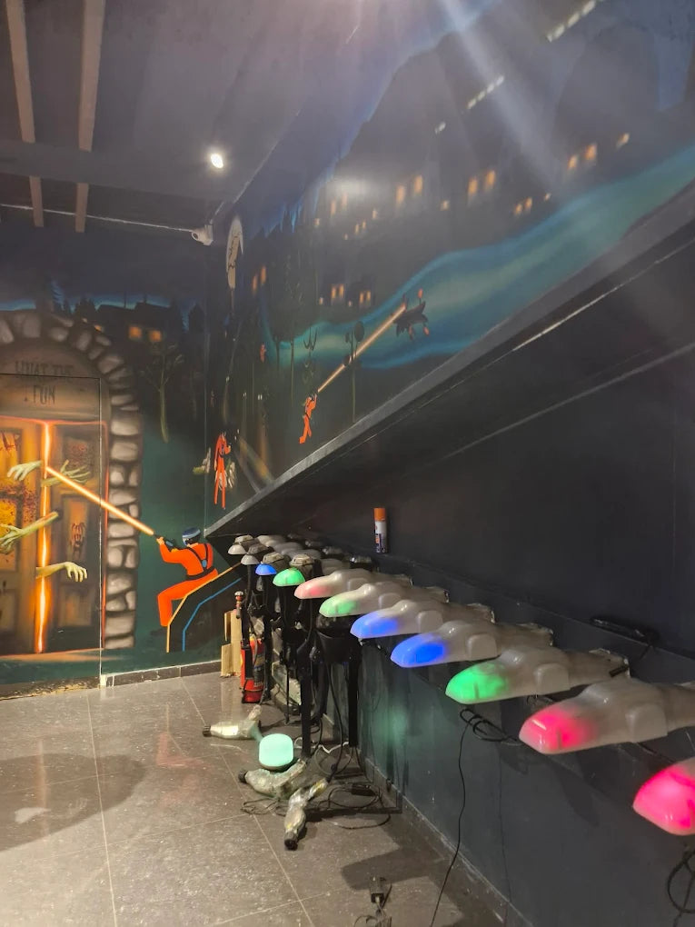 Laser tag arena with glowing vests and a mural of a city at night.