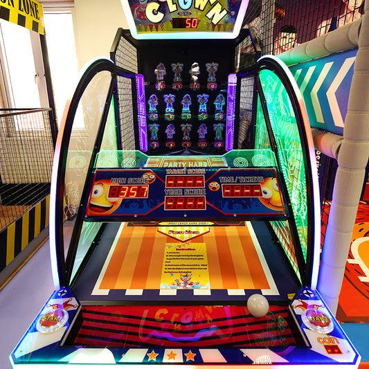 A colorful arcade game with a clown theme, featuring flashing lights and a target score display.