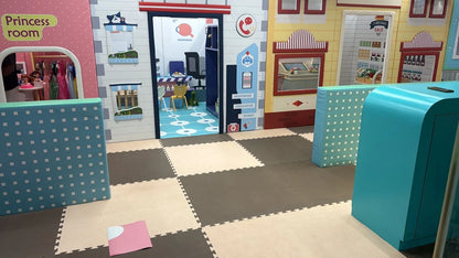 Children's playroom with colorful walls and toys, featuring a 'Princess room' and a toy kitchen.