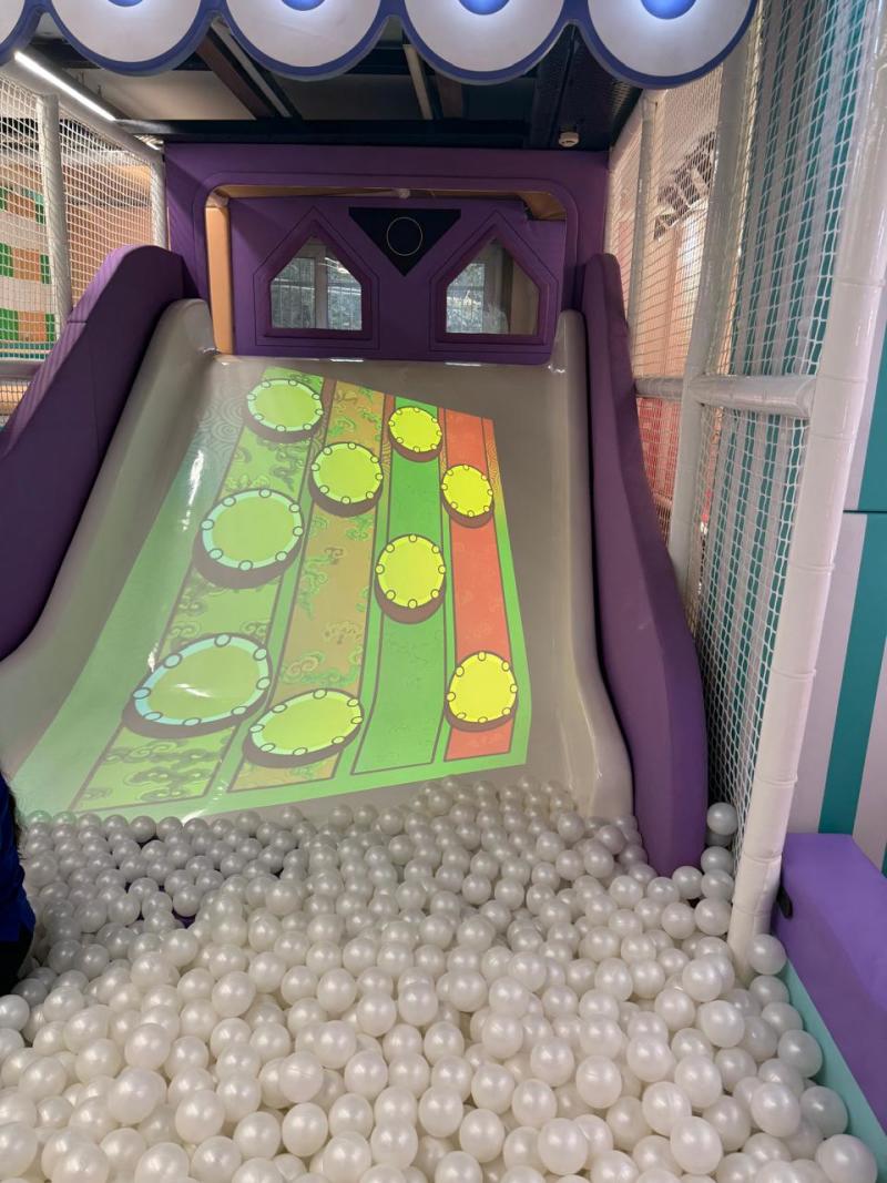 Children's indoor play area with slide and ball pit