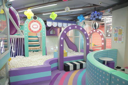 Colorful indoor playground with slides and soft play area