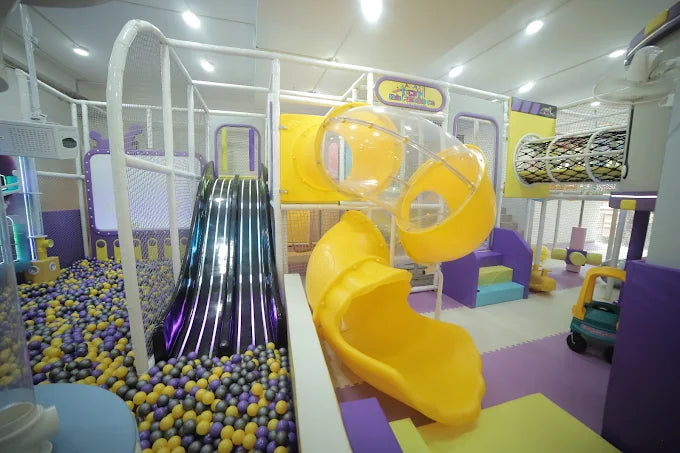 Children's indoor play area with slides and ball pit