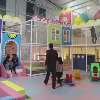 Kids enjoying indoor play area with ball pool, slides, trampoline, pebble pit, donut slide, car ride and wall climbing, designed for safe and active play.