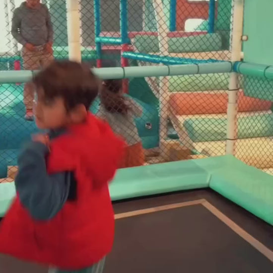 Kids enjoying fun activities at an indoor play area with arcade play zone, featuring safe play zones and engaging entertainment for children.