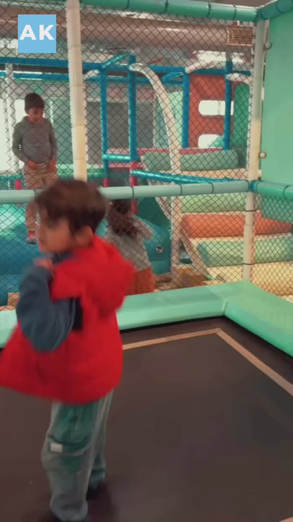 Kids enjoying fun activities at an indoor play area with arcade play zone, featuring safe play zones and engaging entertainment for children.