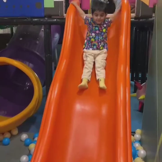 Kids enjoying trampoline, slides, and ball pool fun at an indoor play area, featuring a safe kids zone and exciting arcade play zone activities.
