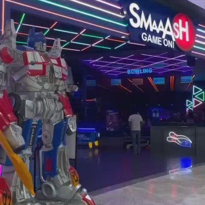 This vibrant arcade buzzes with activity, featuring a diverse range of games from classic bowling and air hockey to modern VR experiences and thrilling rides. Families and friends of all ages enjoy the energetic atmosphere, illuminated by colorful neon lights and the glow of countless screens. The impressive collection of arcade machines and attractions creates a fun-filled destination for everyone.