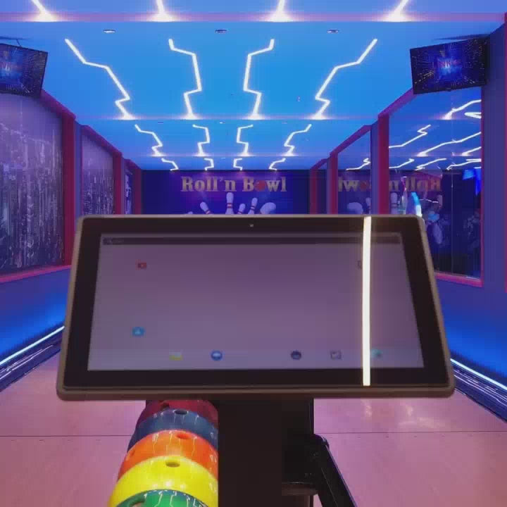 This vibrant indoor amusement park offers a thrilling experience for all ages, featuring a bowling alley, a ball pit with slides, bumper cars, arcade games, and a carousel. The colorful, neon-lit environment creates an energetic and exciting atmosphere, perfect for family fun and entertainment.