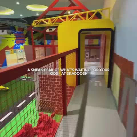 This video showcases a vibrant indoor play area for children, featuring a ball pit, slides, and various themed zones like a police station and a grocery store. The colorful and engaging environment seems designed for toddlers and young children, creating a lively and fun atmosphere. The space also includes a cafe area, suggesting it's a place for both kids and parents to enjoy.
