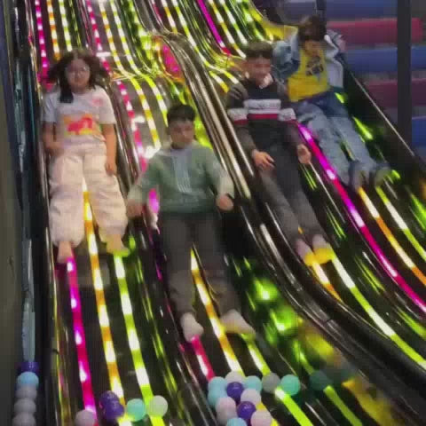 Kids enjoying fun activities at an indoor play area with arcade games and interactive entertainment, offering a lively and engaging experience.