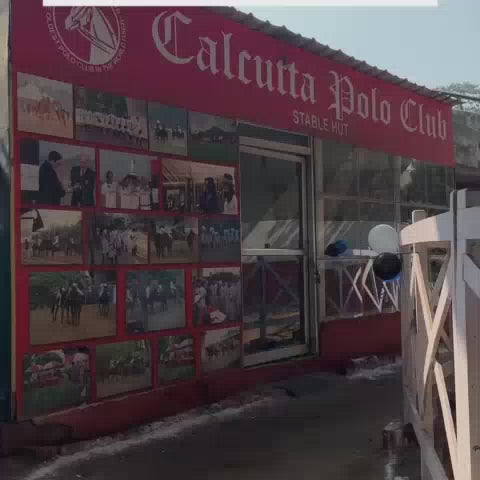 A woman enjoys horseback riding and archery at a polo club. The setting features a stable hut, riding arena, and an archery zone, with a playful atmosphere.