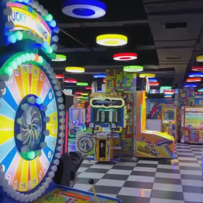 This video showcases a vibrant indoor entertainment center filled with various attractions. It features a trampoline park with a ball pit, bumper cars, VR games, a bowling alley, arcade games, and an adventure zone with rope courses and zip lines. The atmosphere is lively and fun, with people of all ages enjoying the diverse activities.