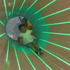 Children of various ages enjoy a vibrant indoor play area filled with ball pits, slides, and interactive games. The atmosphere is lively and fun, with kids actively engaged in play and exploration. Brightly colored equipment and playful decor create an exciting environment for young visitors.
