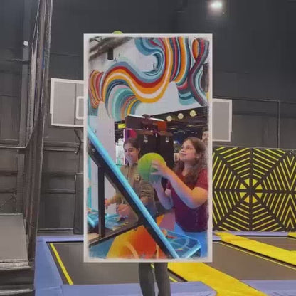 This video showcases a vibrant indoor amusement park filled with various attractions. Young children and teenagers are seen enjoying thrilling rides like a drop tower and a VR simulator, as well as engaging in activities like laser tag and a foam pit. The atmosphere is energetic and fun, with colorful decorations and exciting games.
