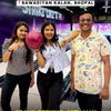A vibrant arcade buzzes with excitement as people of all ages enjoy a variety of games. From thrilling VR experiences and racing simulators to classic basketball and air hockey, the colorful environment offers endless entertainment. Laughter fills the air as friends and families engage in friendly competition, creating a lively and joyful atmosphere.