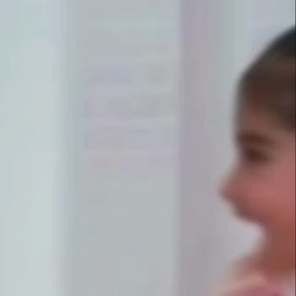 Children of various ages enjoy a vibrant indoor play area filled with colorful balls, slides, and interactive games. The atmosphere is lively and engaging, with kids actively participating in activities like basketball, ball pits, and toy construction. The play space features a playful, cartoon-themed design with bright colors and engaging visuals.