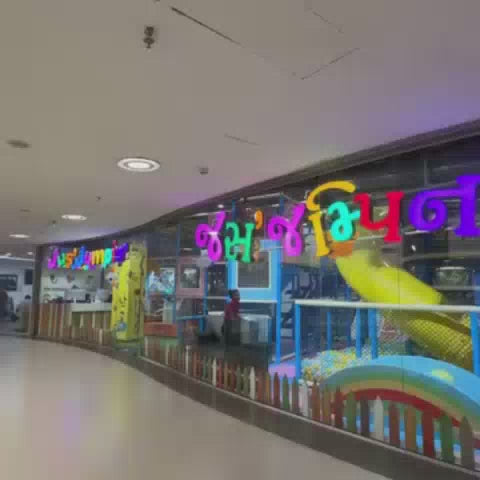 This video showcases a vibrant indoor play area for children, featuring colorful slides, ball pits, climbing walls, and interactive games. The setting is a lively and safe environment designed for fun and active play, catering to various age groups. The atmosphere is energetic and joyful, with children actively engaged in exploring the numerous attractions.