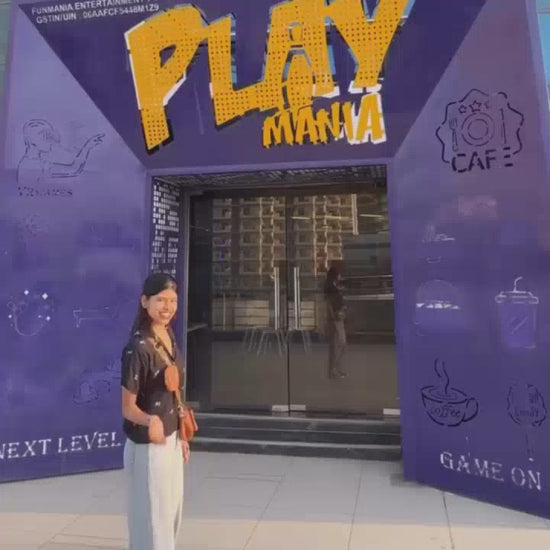 Vibrant indoor entertainment center with arcade play zone, bowling lanes and activities for for all age groups.