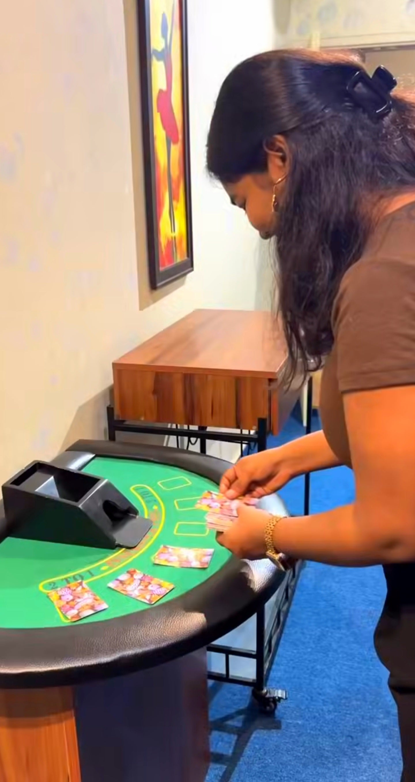 Woman arranging cards on green felt gaming table inside No Escape Room at Rajinder Nagar Delhi